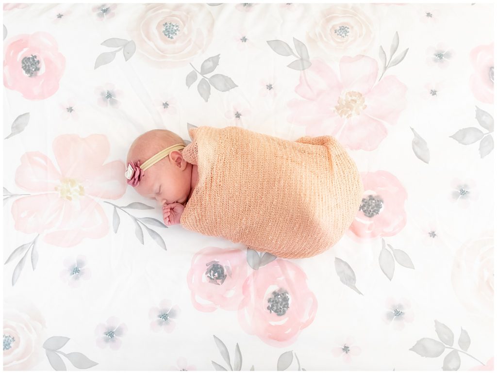 overhead newborn photo of baby girl sleeping