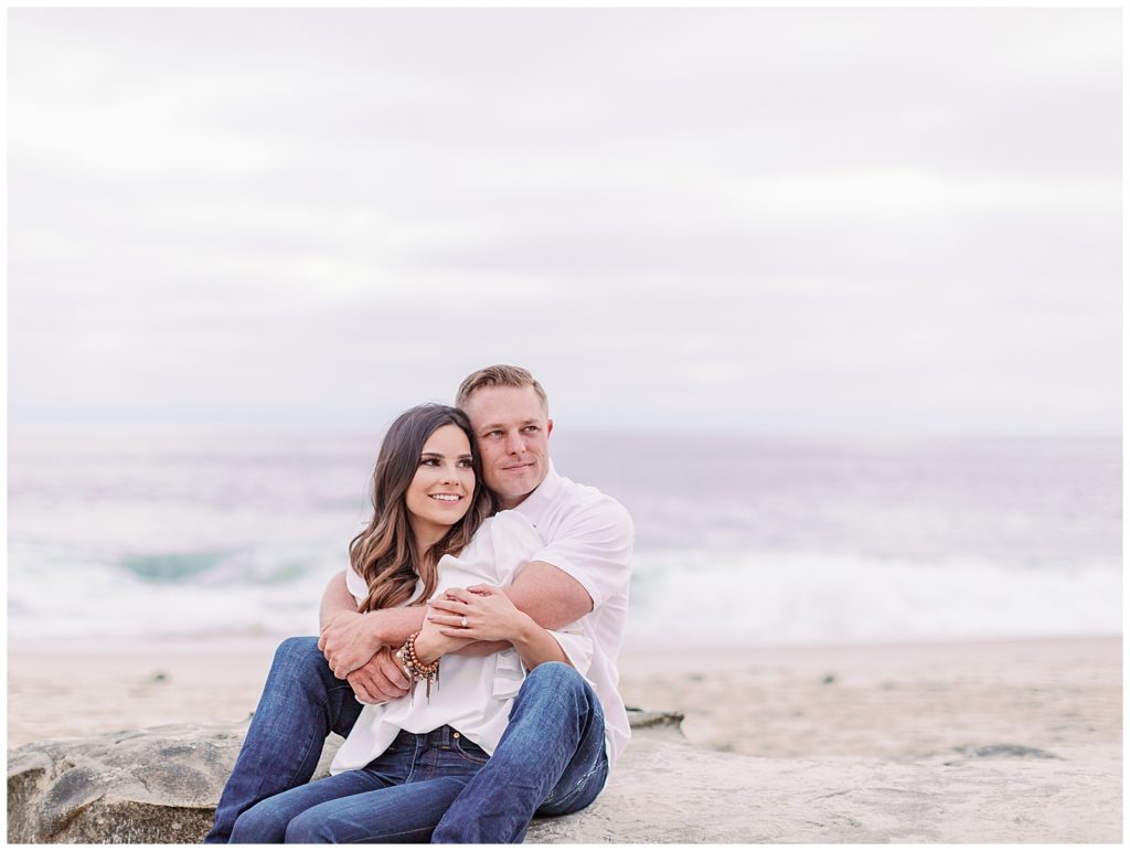 couple sitting on the beach in La Jolla