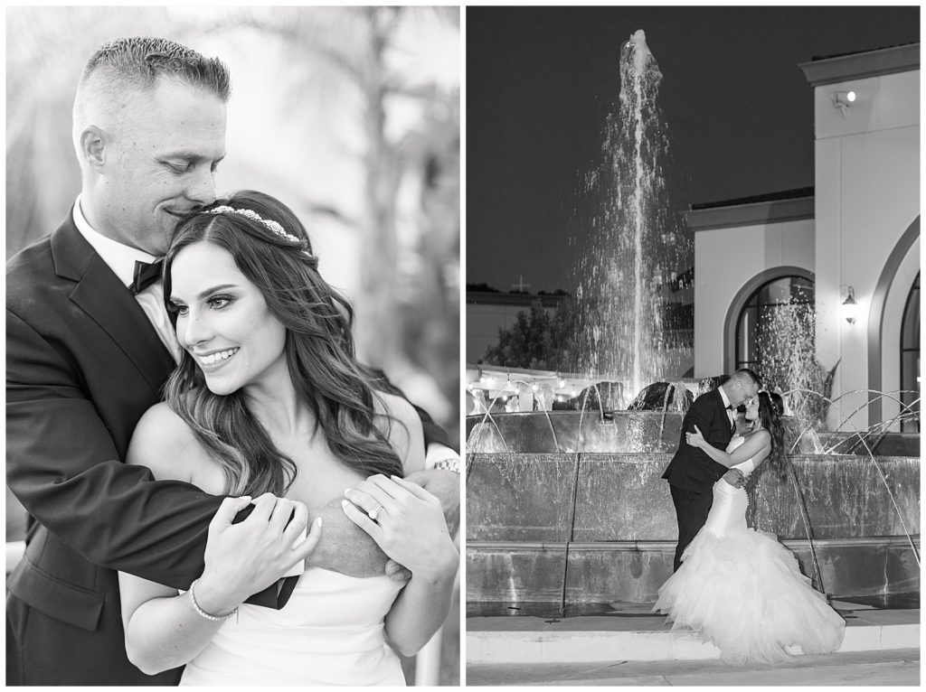 black and white photo of bride and groom kissing in front of a fountain