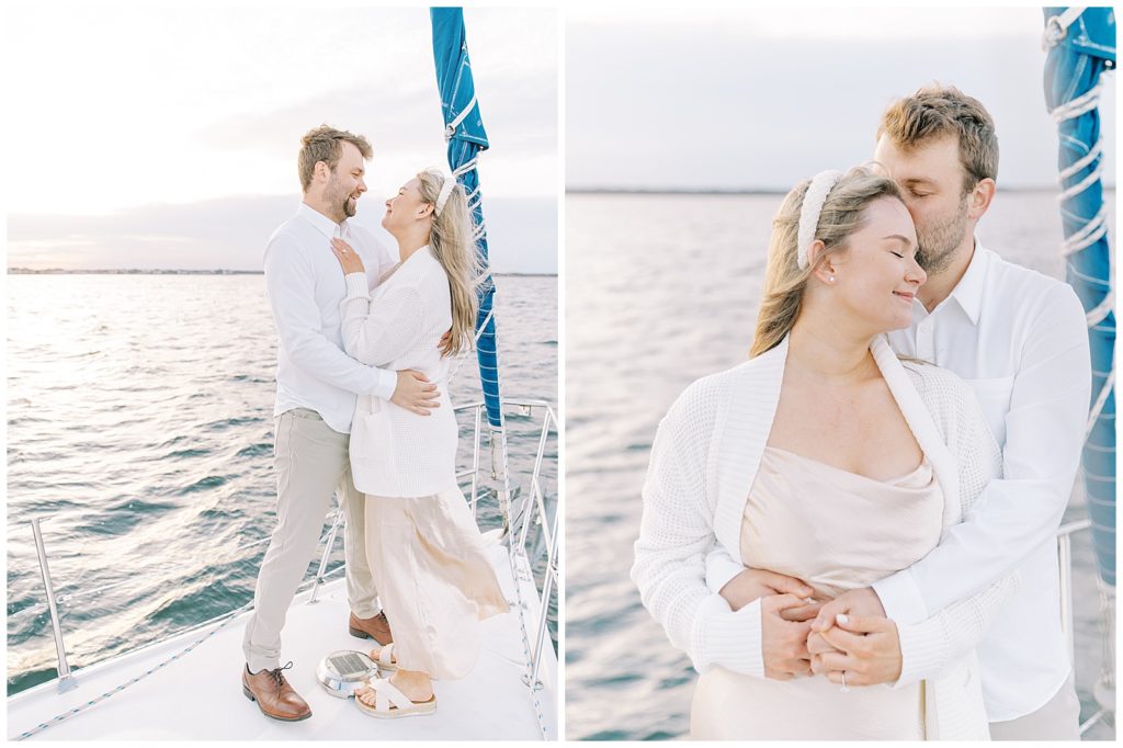 couple on a sailboat embracing each other with the view of the ocean in the back