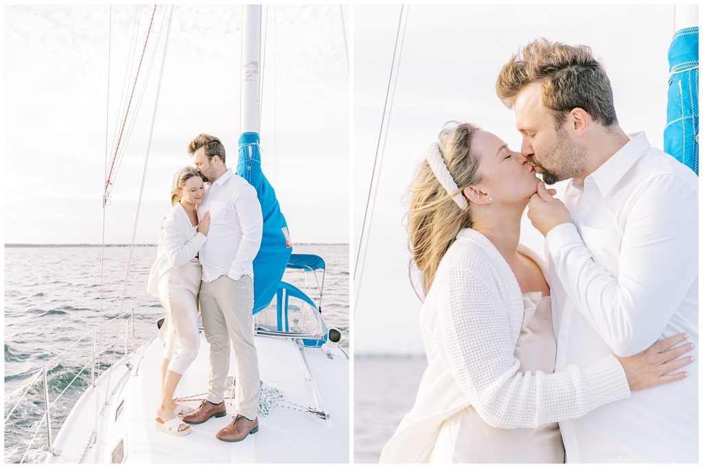 couple on a sailboat embracing each other with the view of the ocean in the back