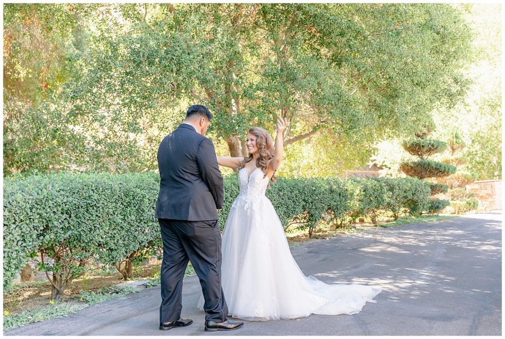 bride and groom share first look at their los willows wedding 