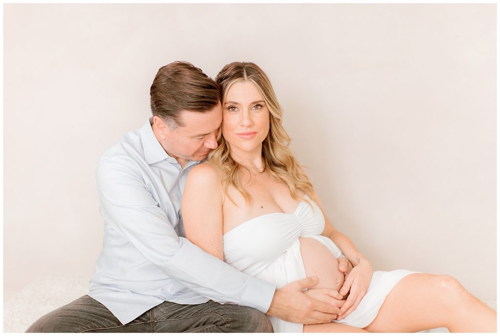 in studio maternity session with mom and dad