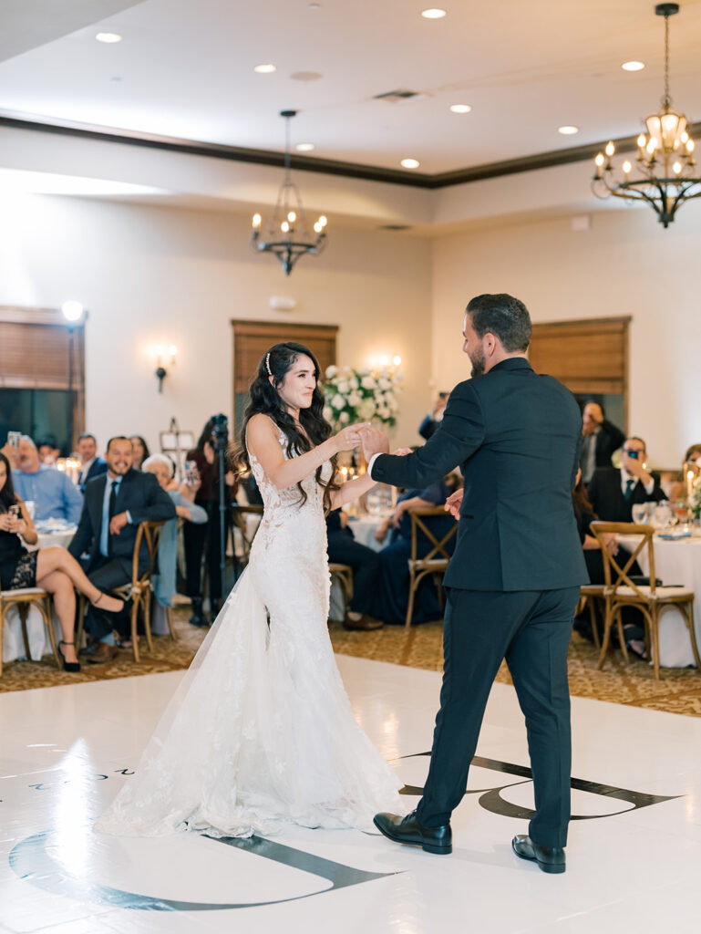 bride and groom first dance on their wedding in the Maderas golf club ballroom