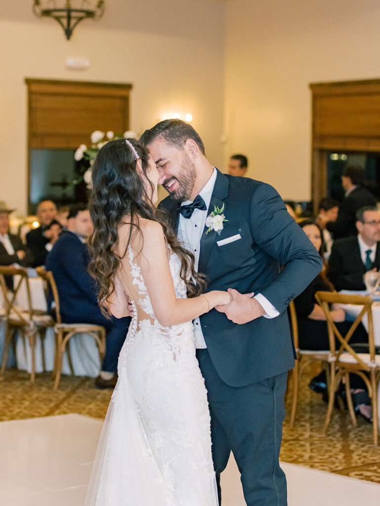 bride and groom first dance on their wedding in the Maderas golf club ballroom