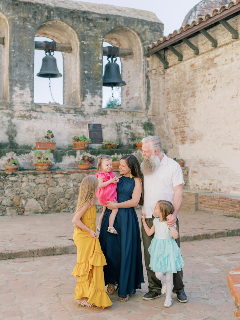 family at the mission San Juan Capistrano in a group