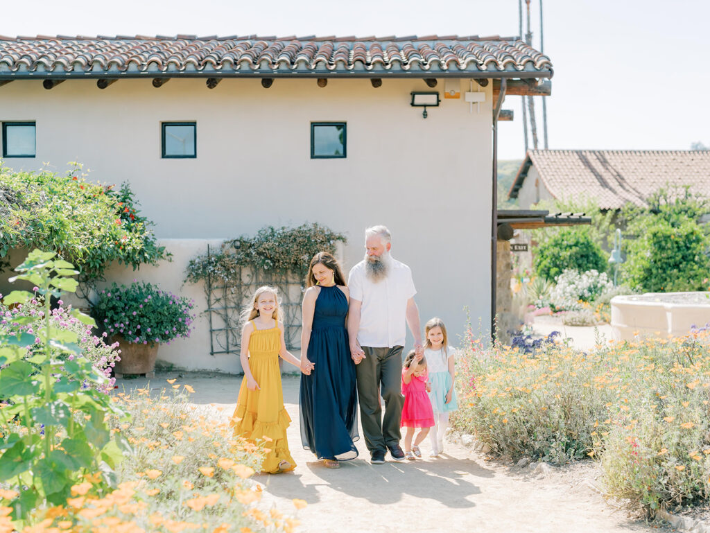 family walking through garden at mission San Juan Capistrano