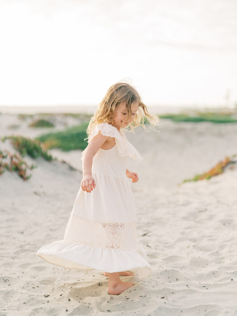 Little girl candid shot for family photo at Coronado beach