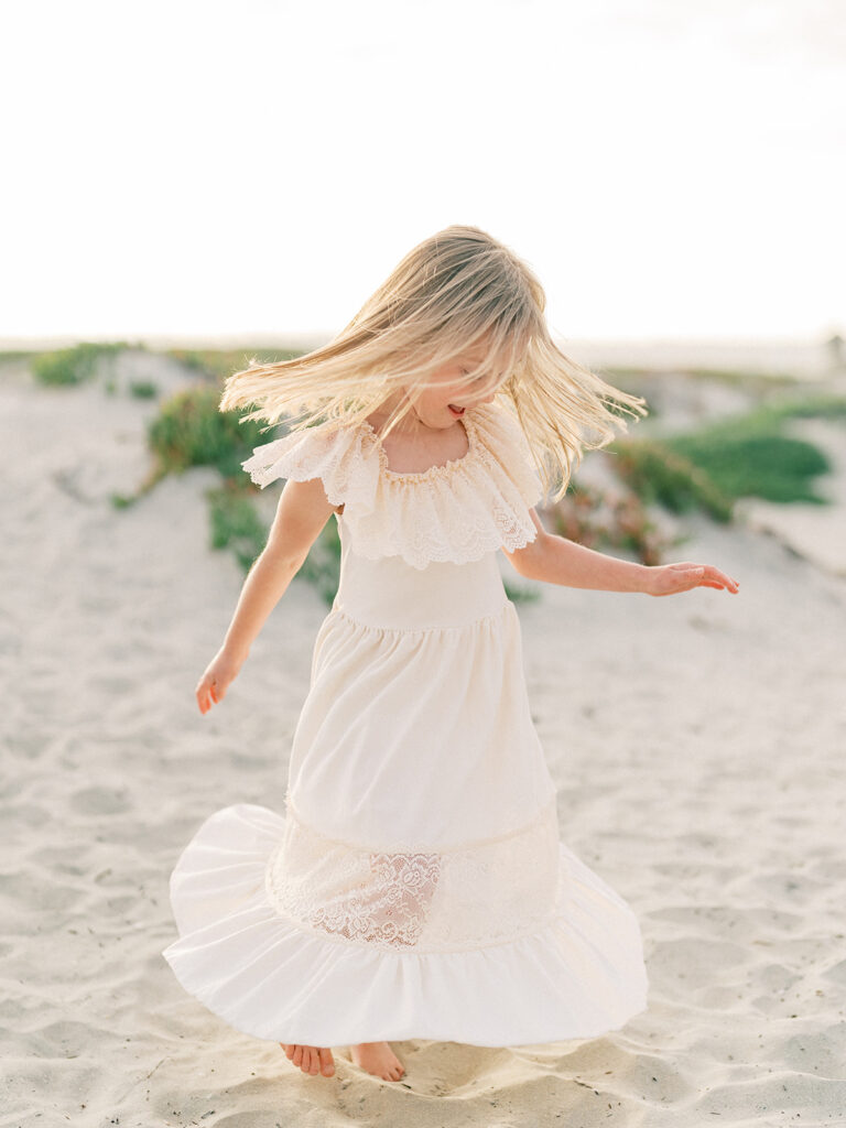 Little girl candid shot for family photo at Coronado beach