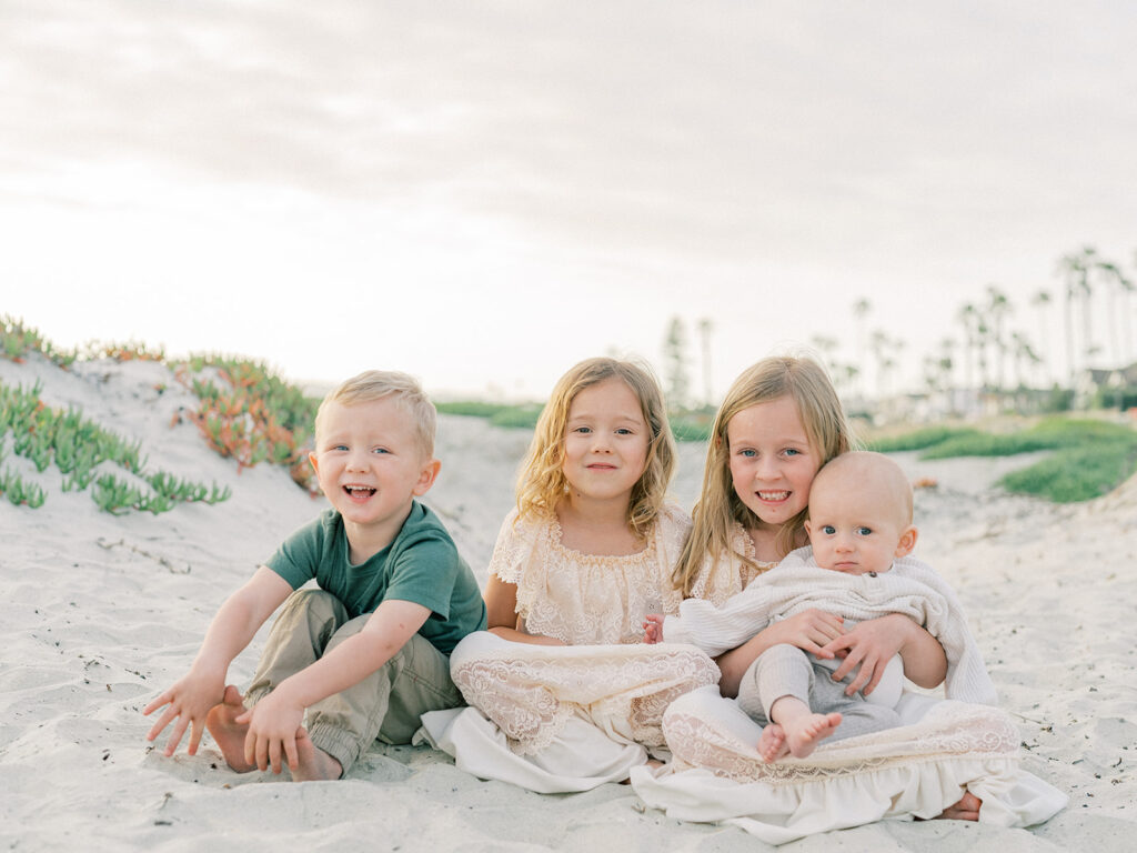 Siblings' family photo at Coronado Beach