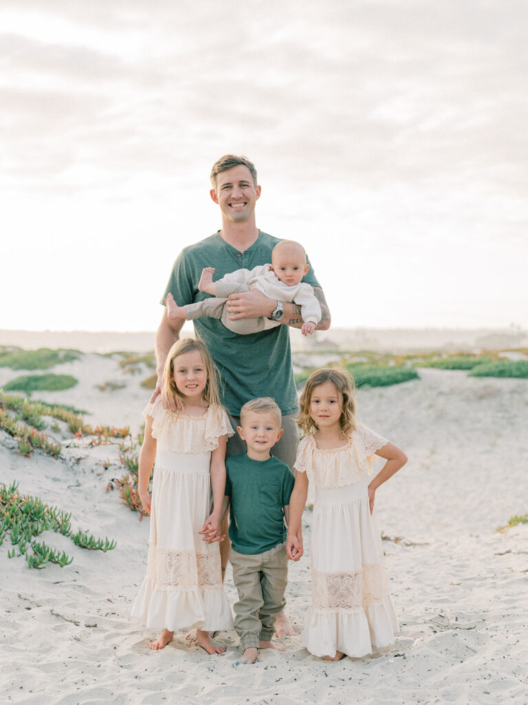 Father with her kids family photo at Coronado beach