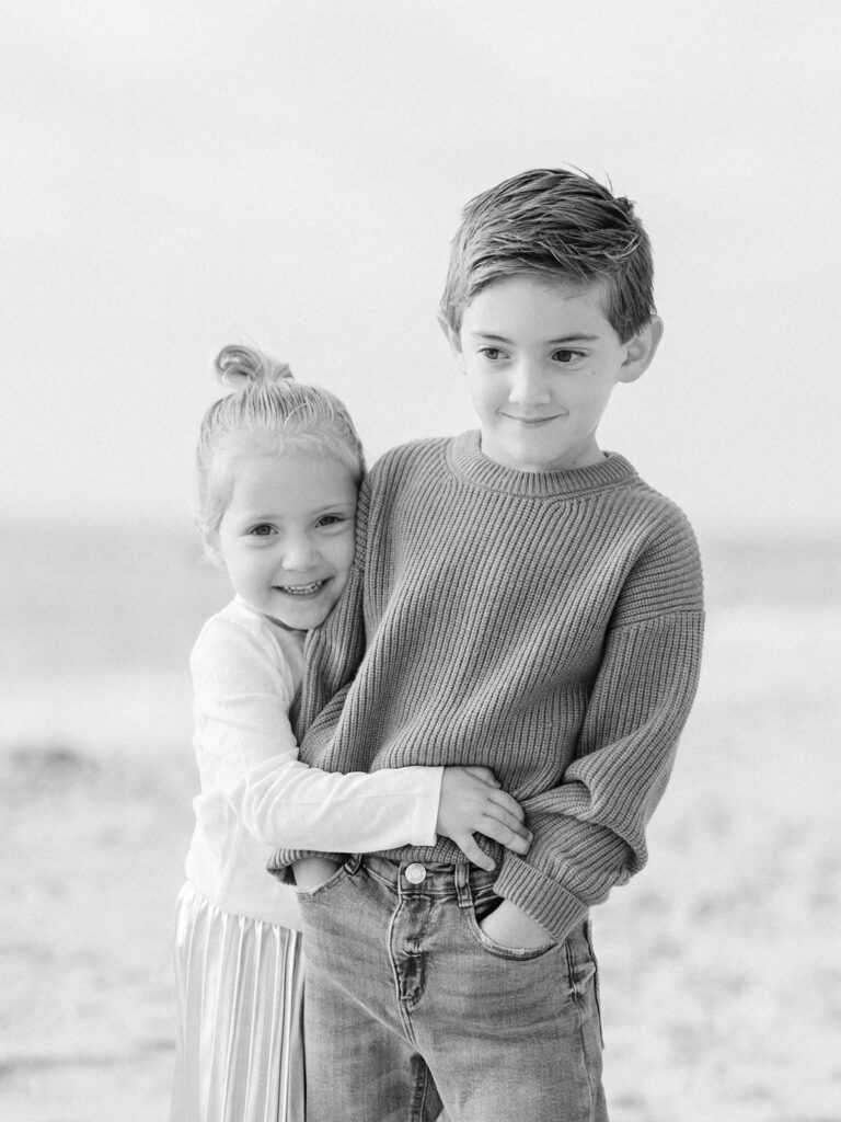 Little girl hugging her brother