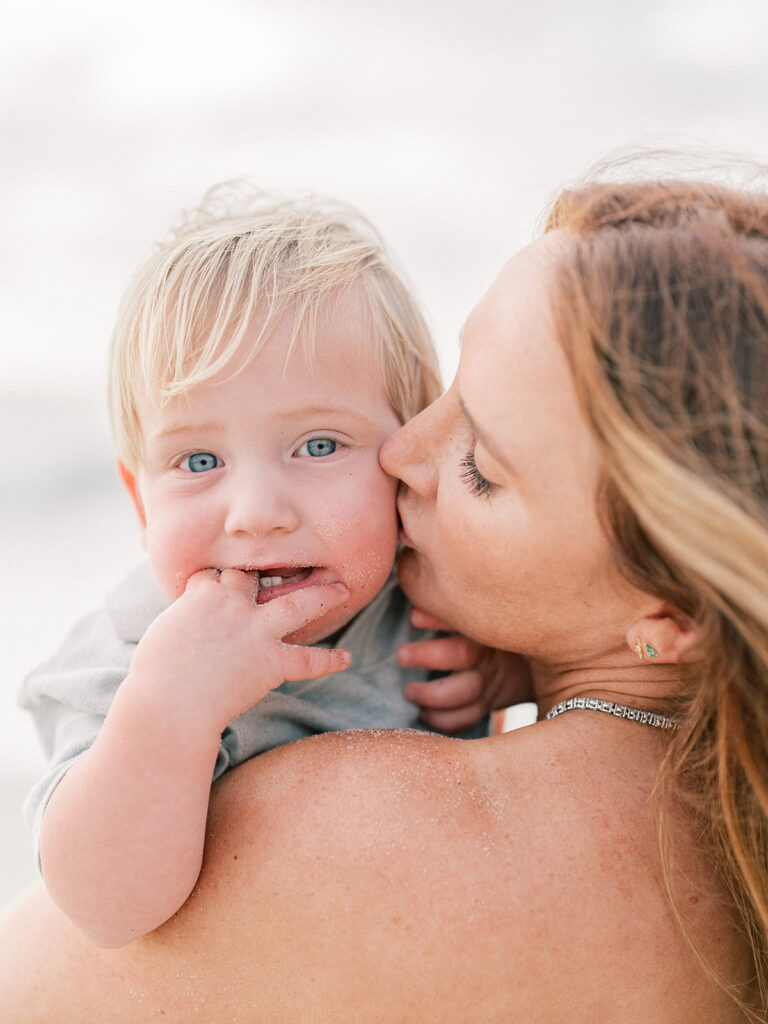 Mother kissing her toddler