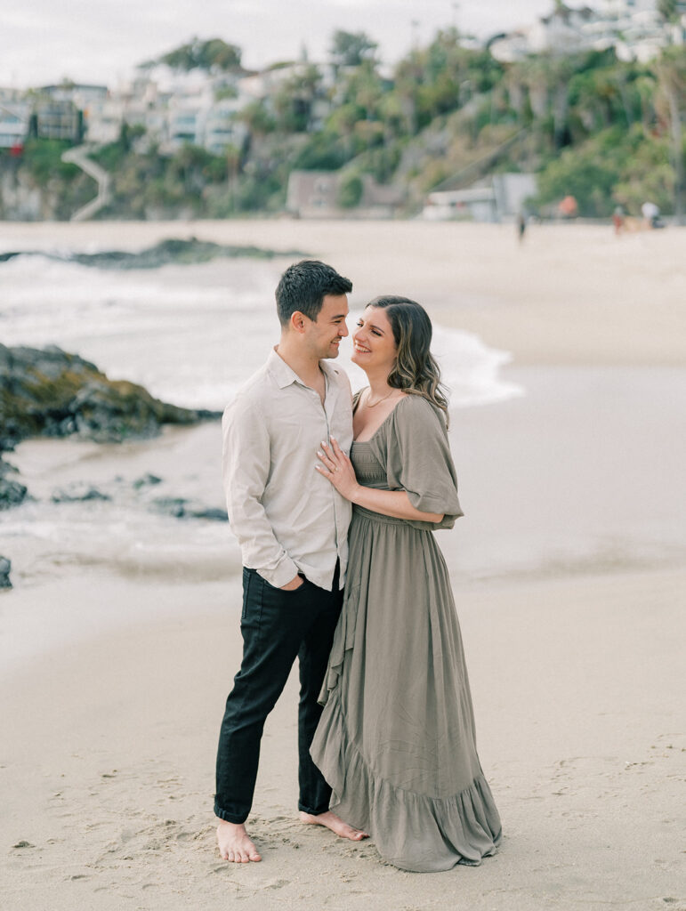 A couple staring at each other lovingly at Laguna Beach