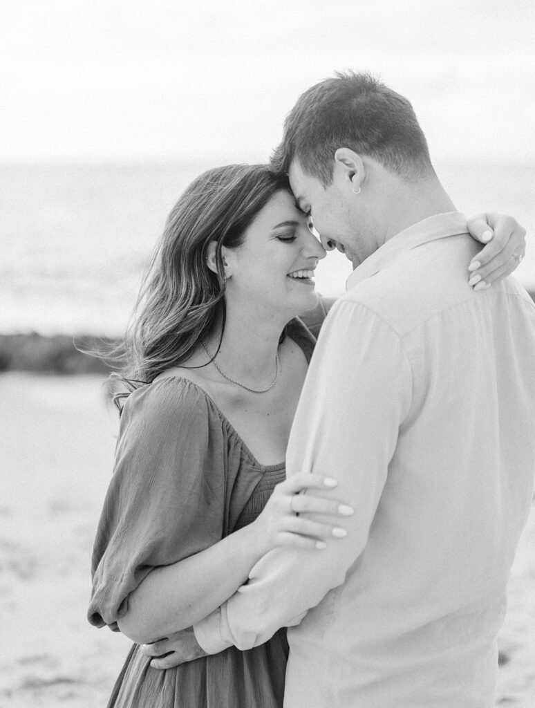 Black and white portrait of a couple during engagement shoot at Thousand steps beach in Laguna Beach