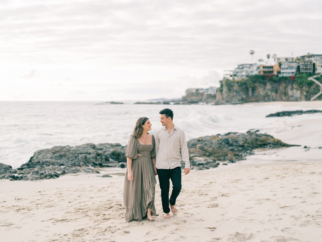 A couple walking at Laguna Beach 