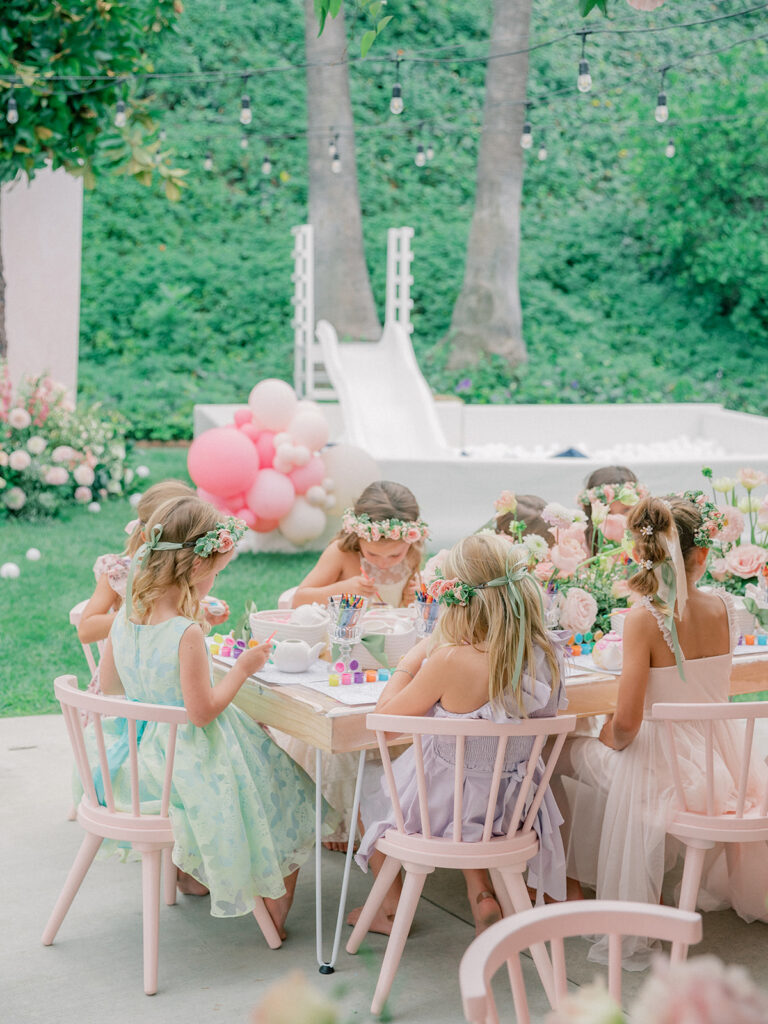 little girls painting during birthday tea party