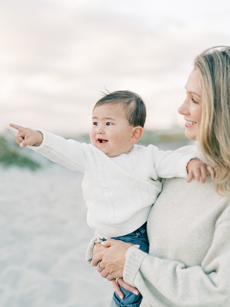 a toddler pointing towards something