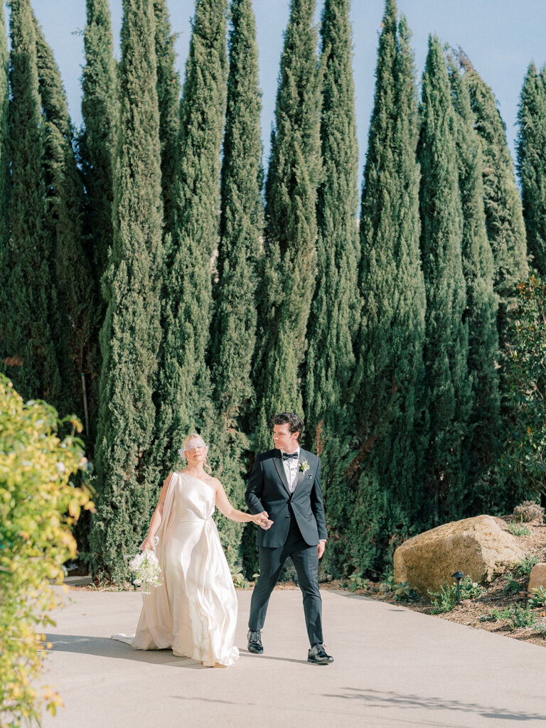 A couple with pine tree backdrop