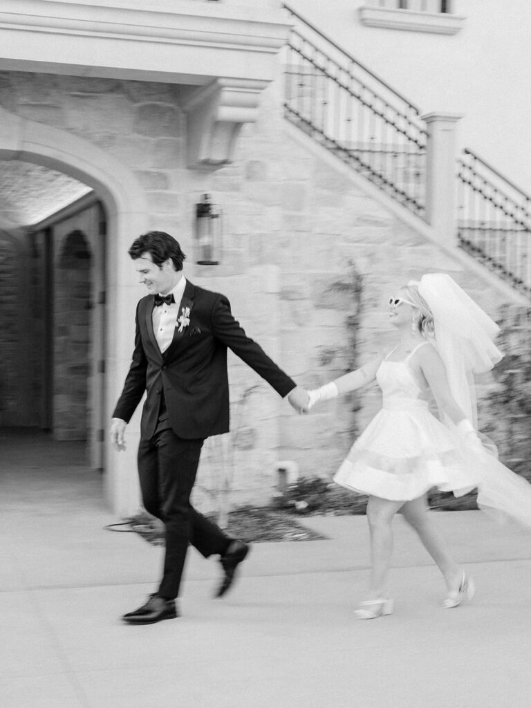 black and white photo of a couple walking at monserate winery during styled shoot wedding