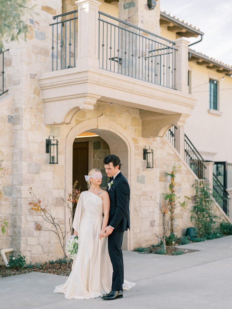 a couple standing in front of monserate winery