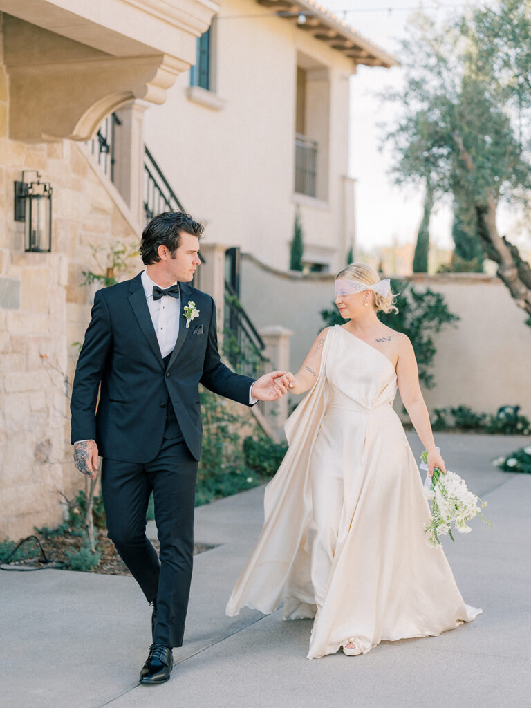 a groom leading his bride