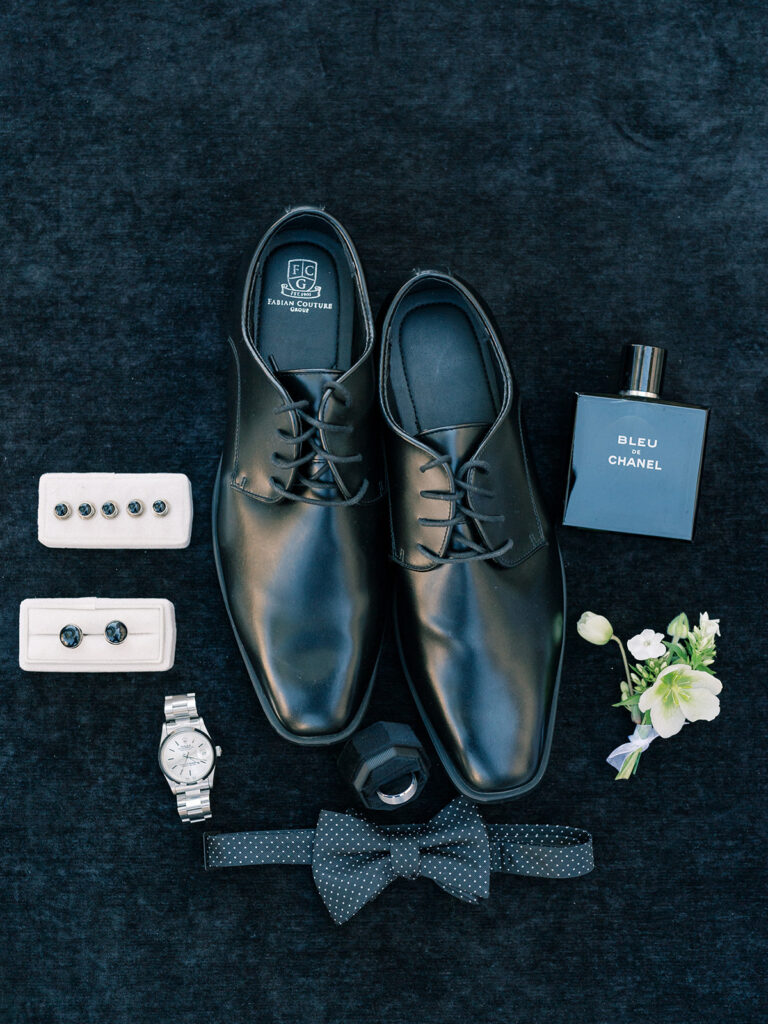 flat-lay photo of groom's details