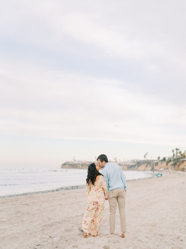 a couple kissing at laguna beach captured by san diego beach photographer