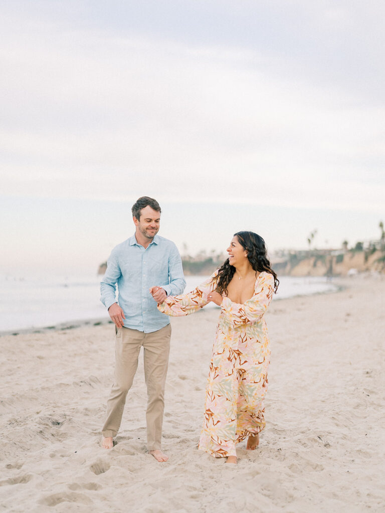 candid moment of a couple at pacific beach captured by san diego beach photographer