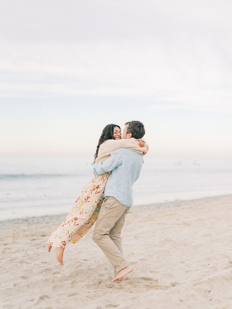 candid moment of a couple at pacific beach captured by san diego beach photographer