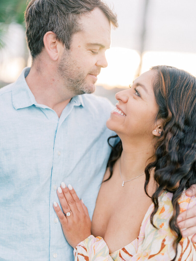 a close up photo of a couple looking lovingly at each other