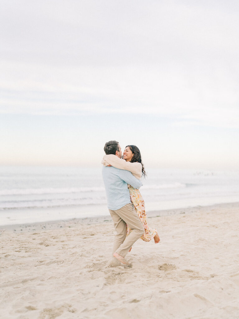 candid moment of a couple at pacific beach captured by san diego beach photographer