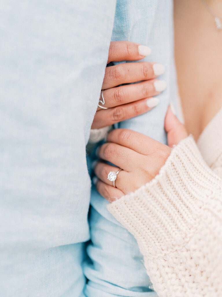 a woman holding his man's arm